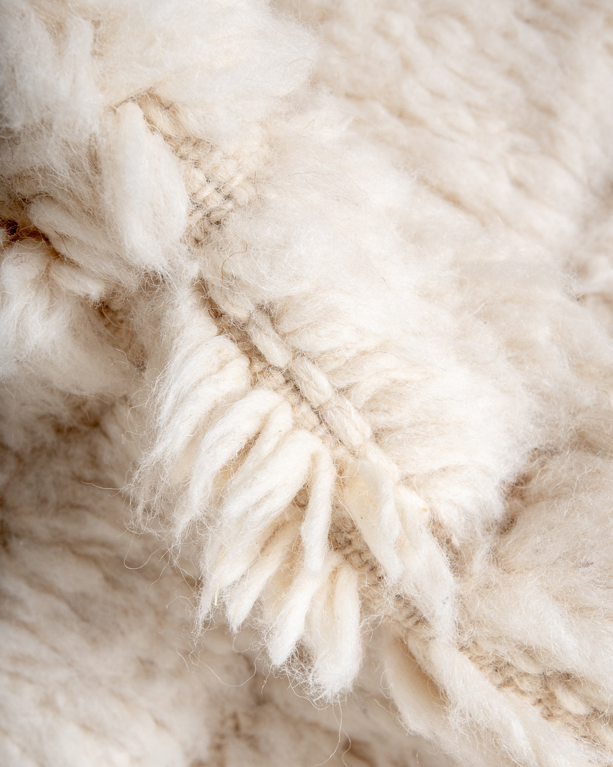 Modern, designer, handcrafted Berber rug from Morocco. Beniourain carpet with minimalist design, natural wool pile and a fluffy texture.